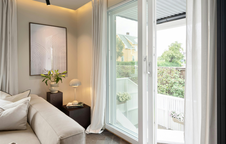 Modern sliding glass door in a bright living room, replacement cost guide by JDM Sliding Doors
