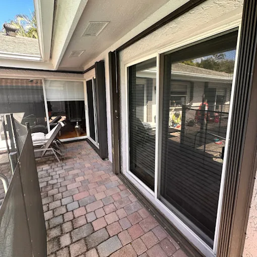 Newly serviced sliding glass door on a Florida paver patio